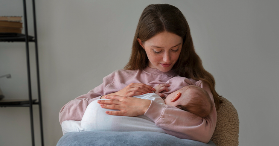 Woman Feeding Infant
